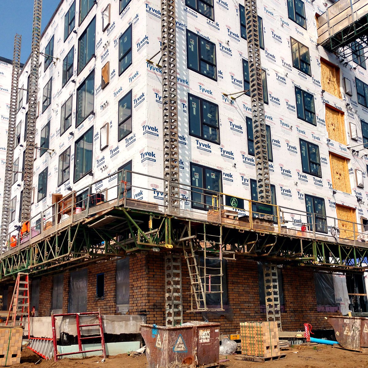 GresserCo's tweet photo. The Hydro Mobile is moving up at The Millennium on 66th as Gresser's masonry crew is making progress on the 94,000+ brick project in Edina. https://t.co/g5nYdAn9in