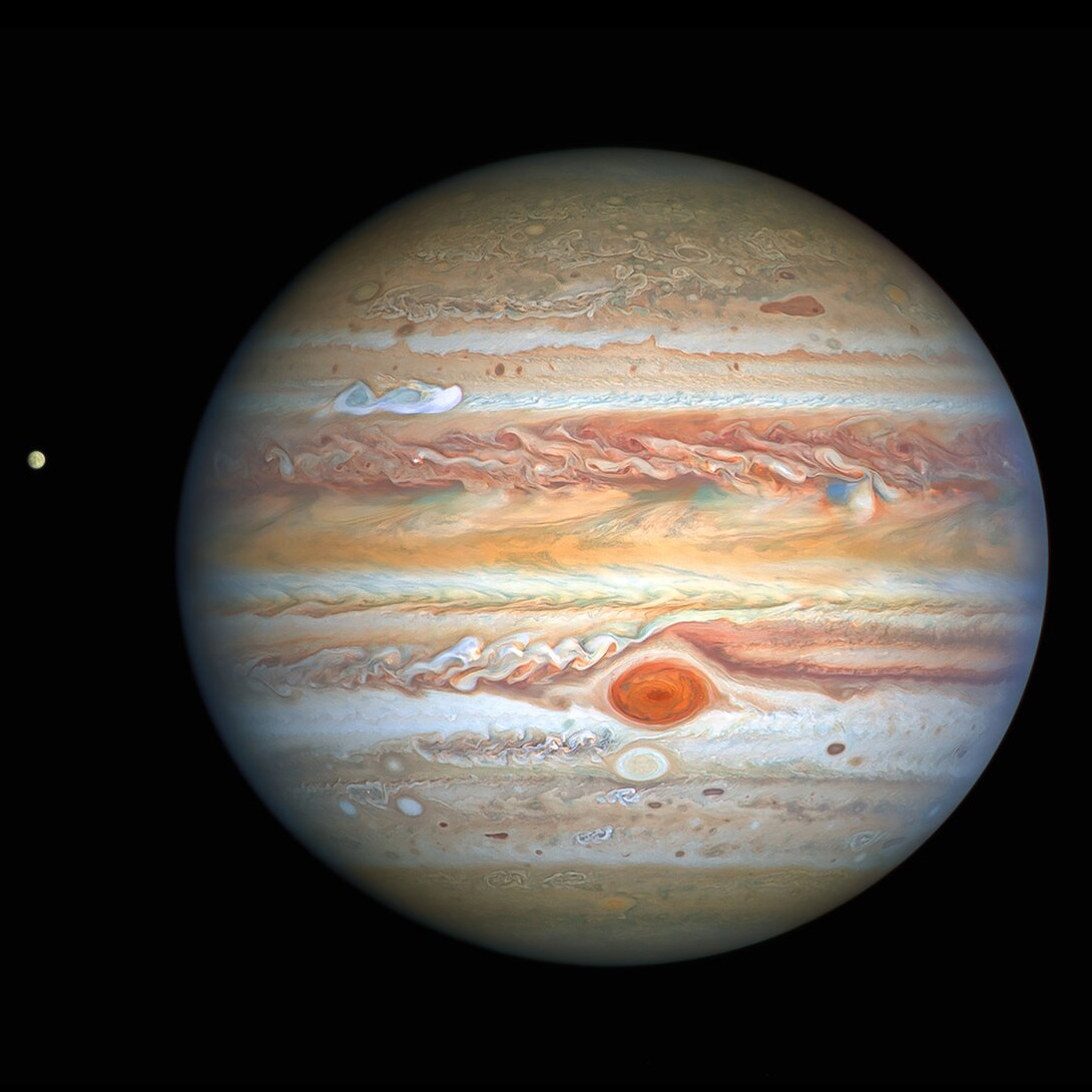 lexfridman's tweet image. Jupiter is looking sexy in a new Hubble photoshoot. Turbulent but beautiful. The red spot is a giant storm larger than Earth. Also, photobombing is Europa, a moon that is likely to have liquid water under its icy surface, and therefore might also have extraterrestrial life.