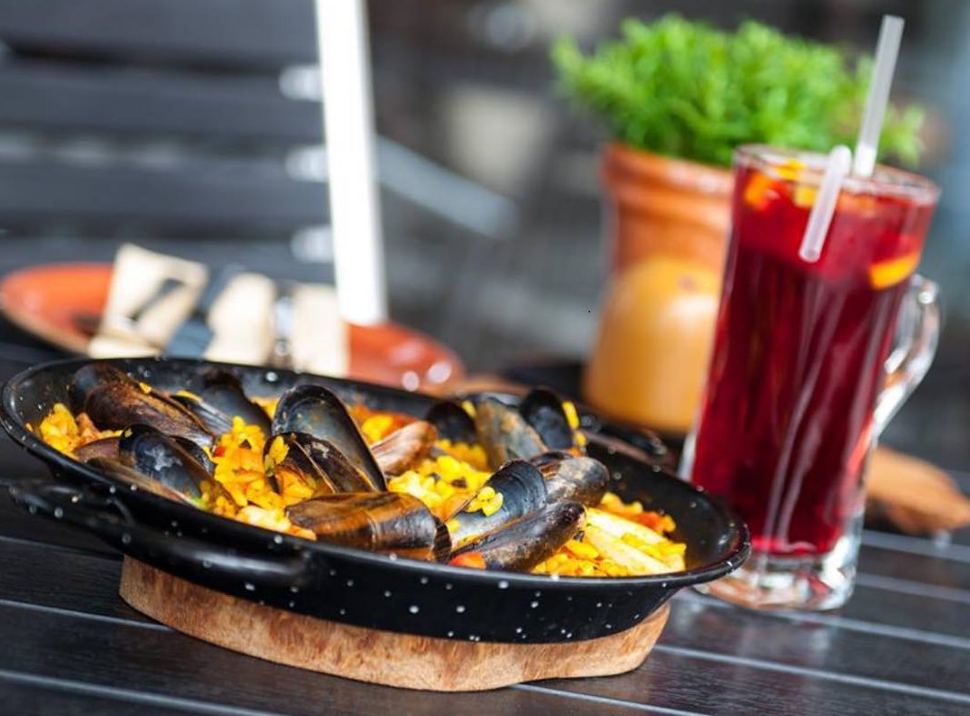 Missed out on a holiday this summer? Enjoy a taste of the Mediterranean at the Mailbox with <a href="/BarEstiloTapas/">Bar Estilo</a> – our favourite dish is the Estilo paella, featuring spicy chorizo, mussels and squid.
