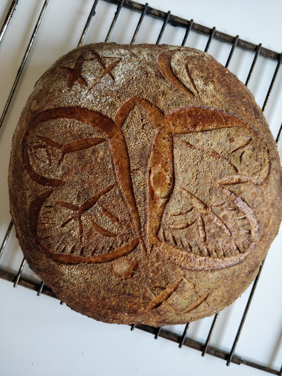 Netherking9's tweet image. With the previous tweet in mind. 
I tried sourdough sandwich loaves for lunches during the week and a normal sourdough cob but big enough I could try and get arty with it! First time for both of these definitely room for improvement!