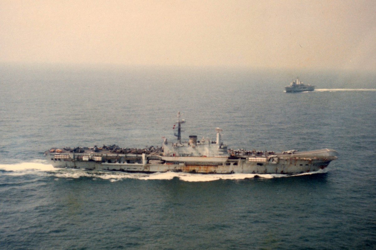 The sad sight of @IndianNavy aircraft carrier INS Viraat, formerly the <a href="/RoyalNavy/">Royal Navy</a>'s HMS Hermes, flagship of the #FalklandsWar task force, being towed out of Mumbai on her final journey to the scrapyard...