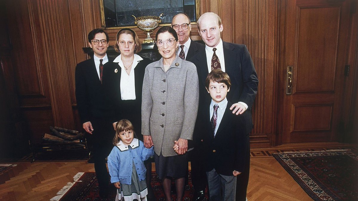 1) Sworn in by Chief Justice Rehnquist, as Marty looks on, adoring.2) After the ceremony, posing with family, she holds the hands of her granddaughter Clara and grandson Paul.3) An informal group photo taken of the US Supreme Court in December 1993.