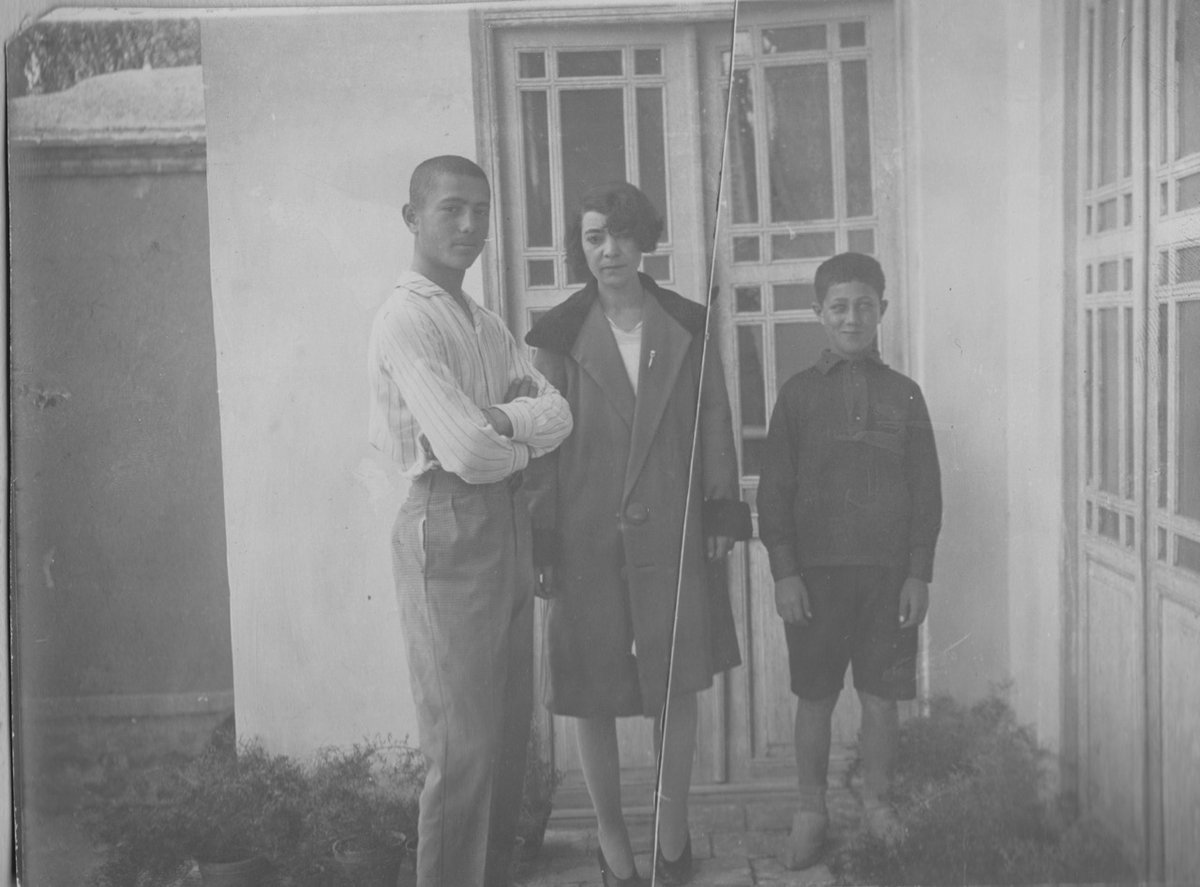 Between 1917 + 1918, Ebrahim's followers assassinated at least a dozen high-ranking officials, including newspaper editors and the minister of finance. In September 1918, however, he was apprehended, imprisoned and shot, devastating the 4 year old Davoud (here, L, as a teen)