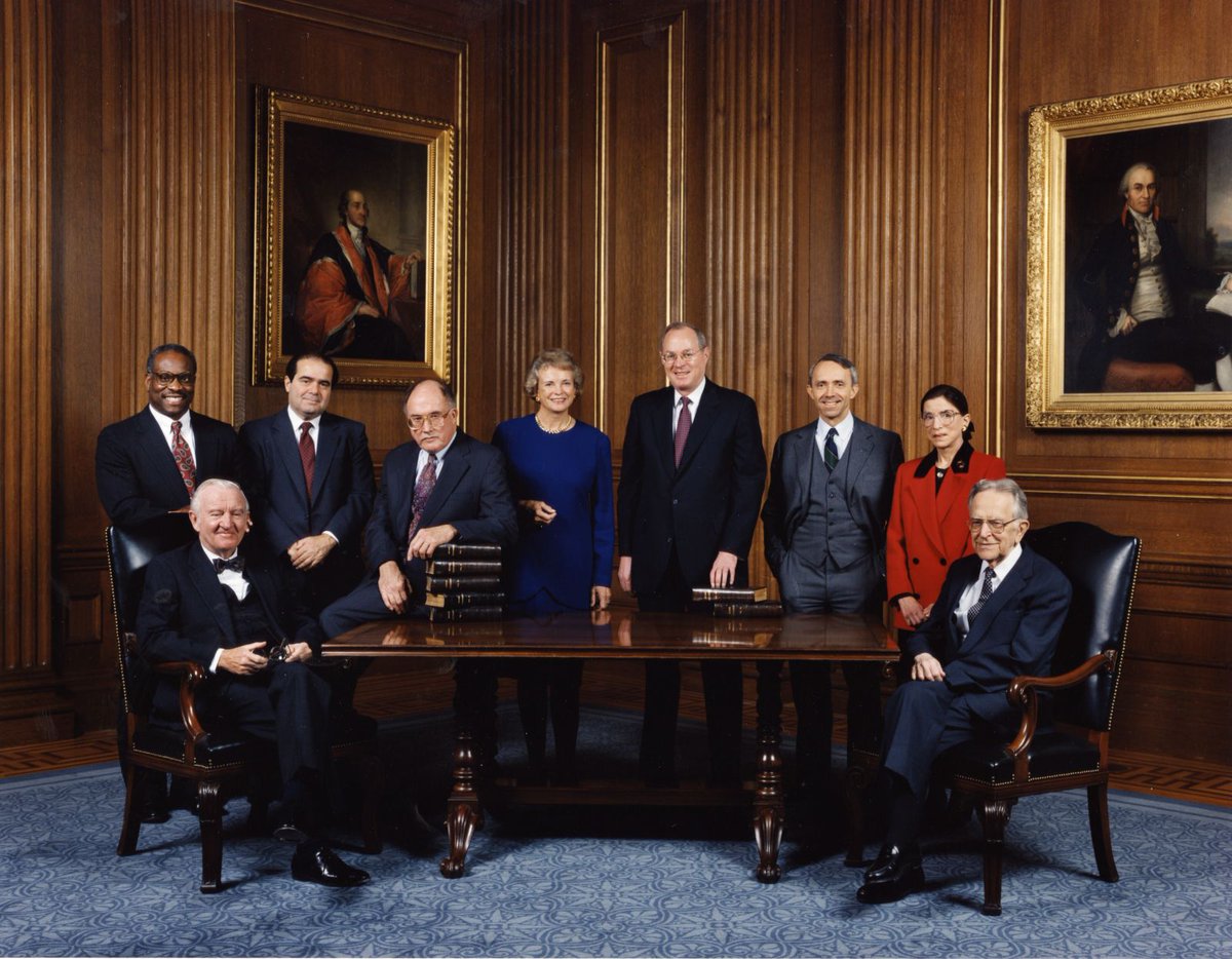 1) Sworn in by Chief Justice Rehnquist, as Marty looks on, adoring.2) After the ceremony, posing with family, she holds the hands of her granddaughter Clara and grandson Paul.3) An informal group photo taken of the US Supreme Court in December 1993.