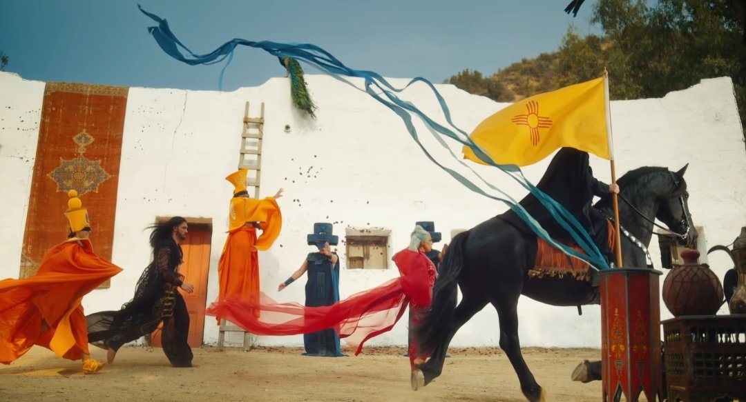 This next scene shows how the guys in blue (police) and in yellow (firefighters) are almost like announcing Gaga& #39;s death in her world because of the horse. But they were running to help everyone, like what they do after you call 911