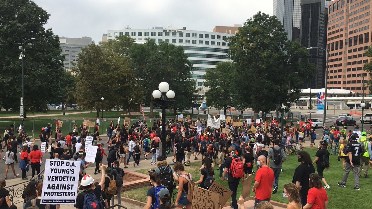 Crowd is now lining up behind the banner, getting ready to march  #DropTheChargesCO