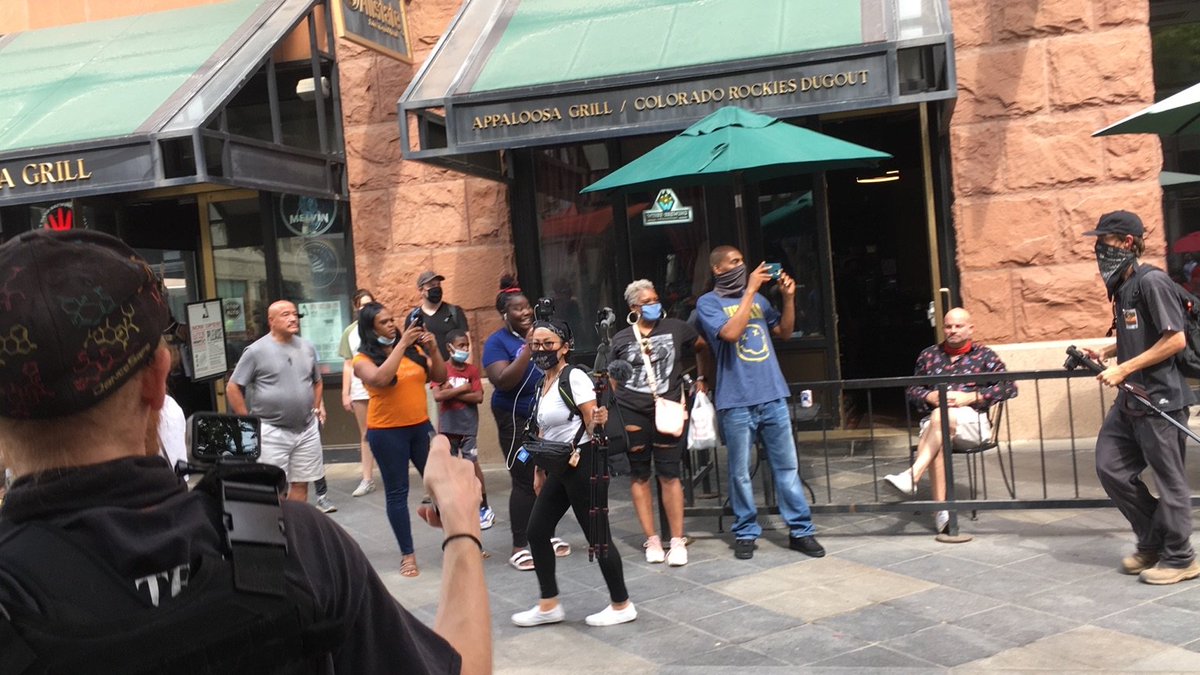 Bystanders cheering on the anti-racist march or joining as it passes  #DropTheChargesCO