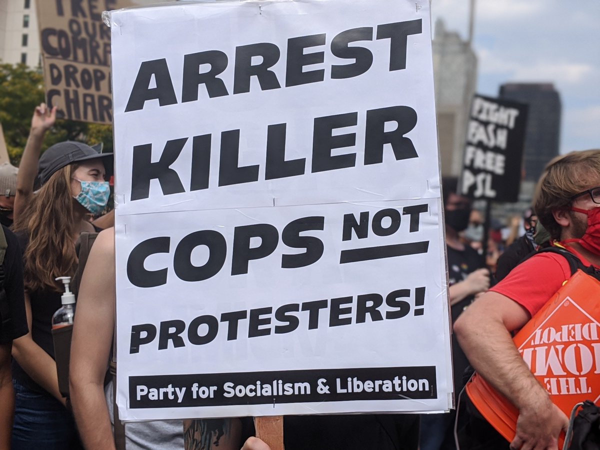 "Arrest Killer Cops! Not protesters!"