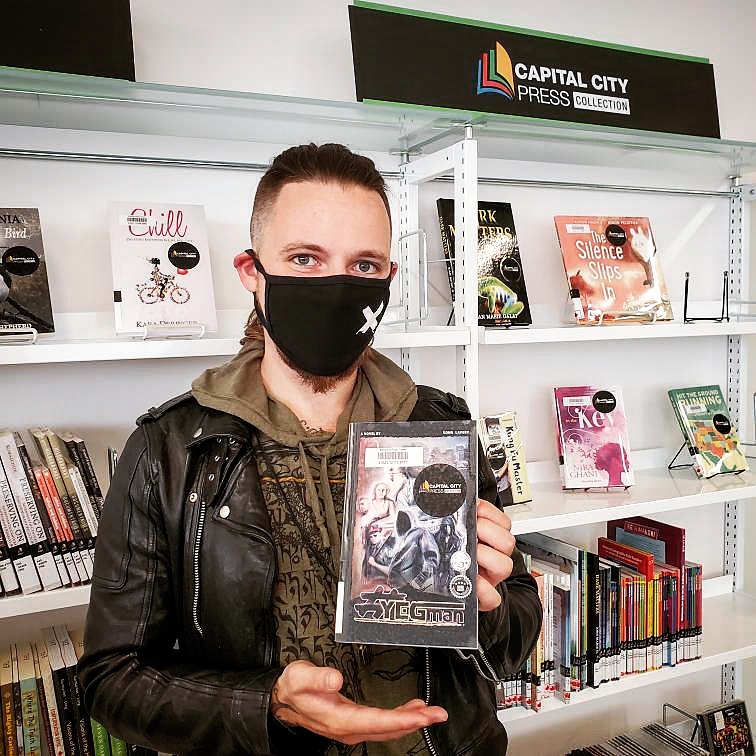 konnl's tweet photo. Honoured to have #YEGman selected to be a part of the Capital City Press collection, featured at the new downtown @EPLdotCA. 
Check out the new location! They have a dinosaur zoo.
#yeg #capitalCityPress #epl #readLocal #yegWrites https://t.co/hE5H4Ms7kT