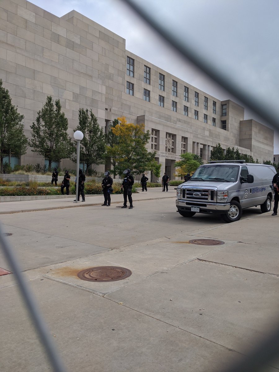 Marching past militarized cops at the jail."The cops and klan go hand in hand!"