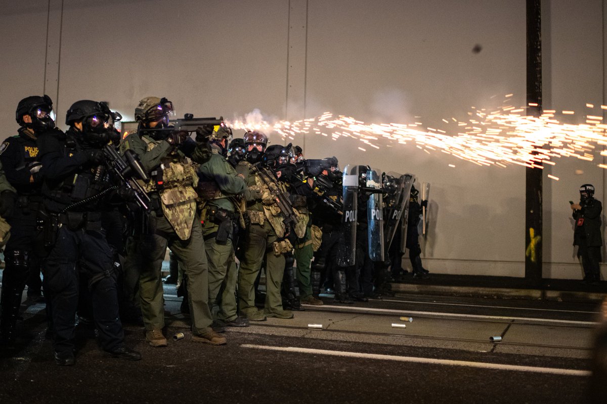 Photo recap from last night- Protesters and federal agents face off at the ICE building in Portland, OR