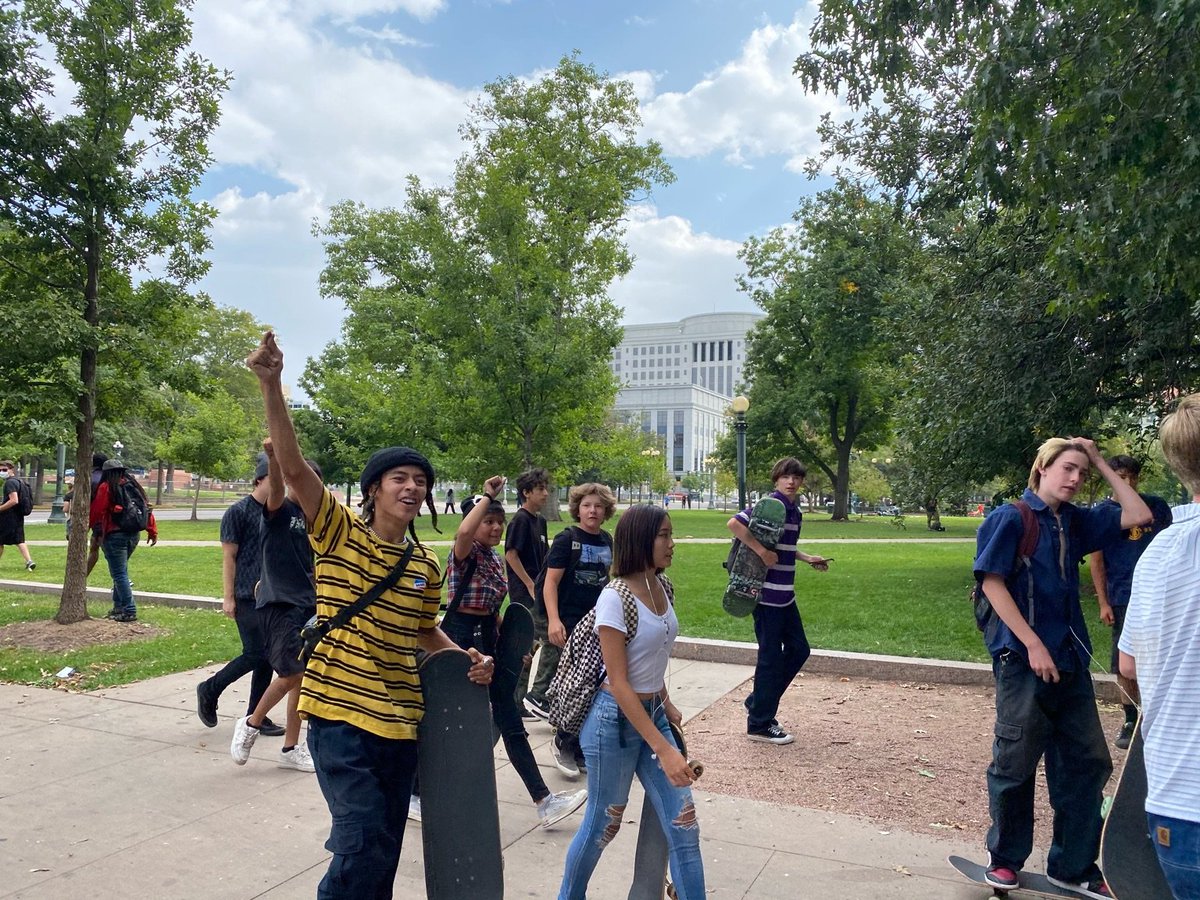 Dozens of kids on skateboards riding alongside the march in solidarity!