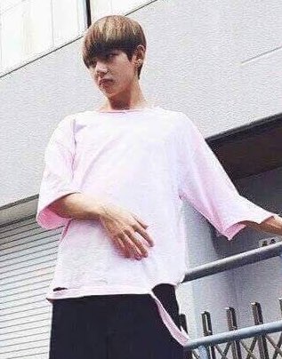 Taejin in distressed pink shirt