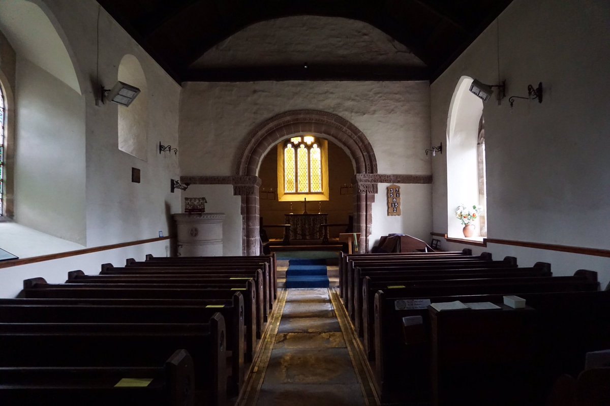 Inside, the chancel arch is a showstopper. Nailheads, doves, a sort of variation of egg and dart, and saints are cut into red sandstone.4/8