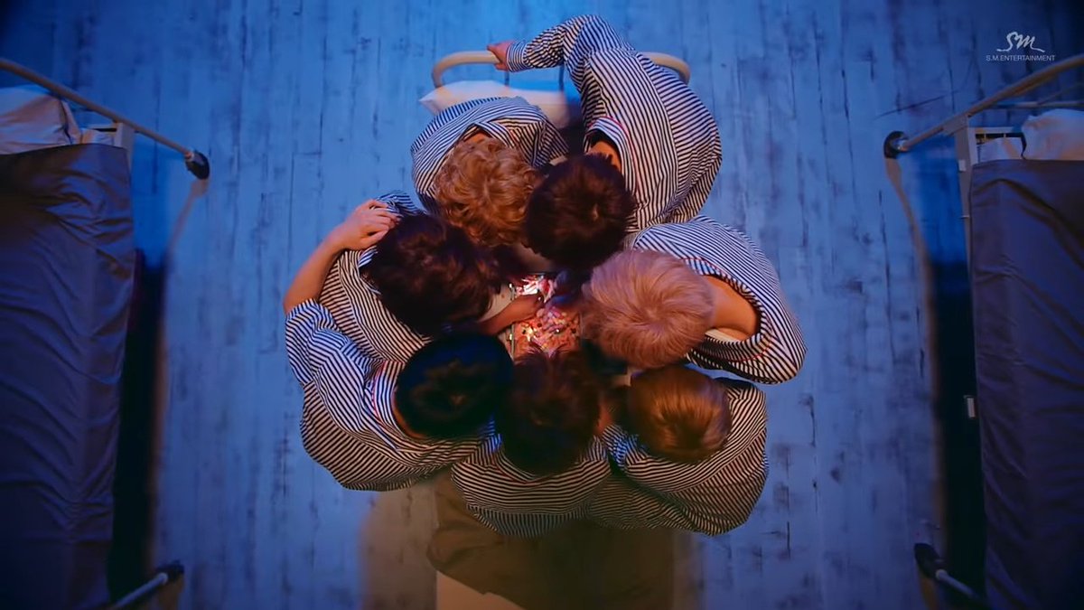 2. Blue-confined comfort-ignorance-"dreaming" hence blue colors are evidently seen for NCT DreamExhibit A, Chewing Gum MV-heavy blue tones-kids living together in a dorm with strict rules