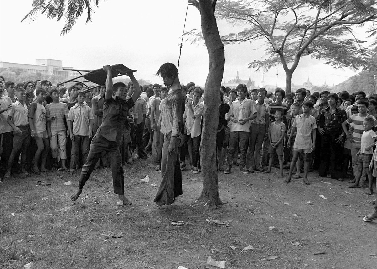 On October 6, 1976, Thai soldiers, police and state-backed ultraroyalist militias stormed Thammasat University. Students were shot, blown up by grenades, and beaten to death. Their corpses were publicly mutilated and violated. 26/33