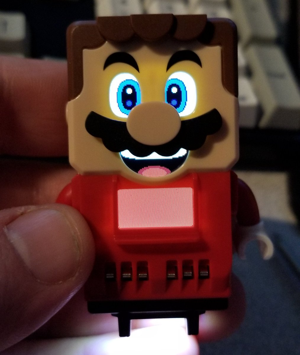 And here's the mario! With batteries, but not put together otherwise.He's got eyes that blink, a mouth, and a red belly.