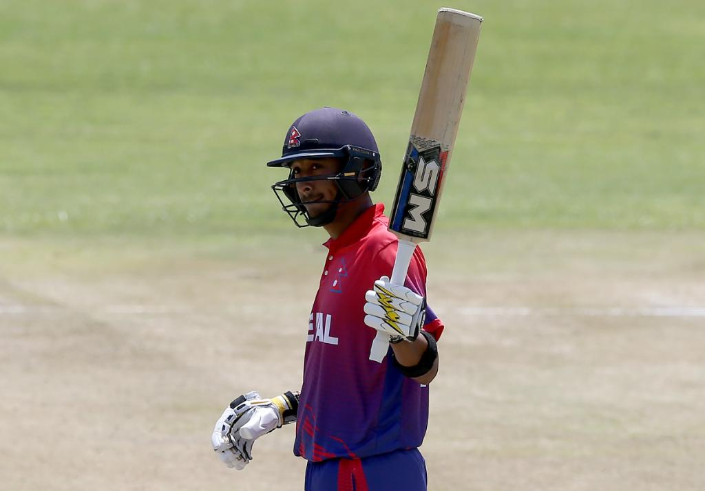 #OnThisDay last year, Paras Khadka became the first T20I centurion from Nepal 👏 

He smashed an unbeaten 52-ball 106, leading his team to a nine-wicket victory over Singapore!