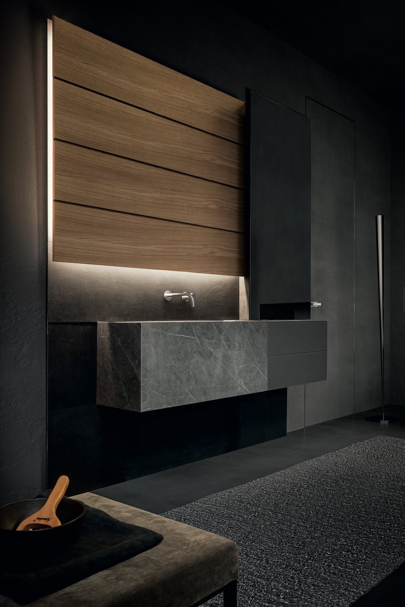 BLADE Bath Collection #NoceMilano Orderly geometrical shapes are emphasised by a combination of different materials: slatted boiserie in noce Milano, shallow suspended washbasin in stone grey stoneware, lacquered glass drawers and storage mirror. #modulnova #bath #bathroom