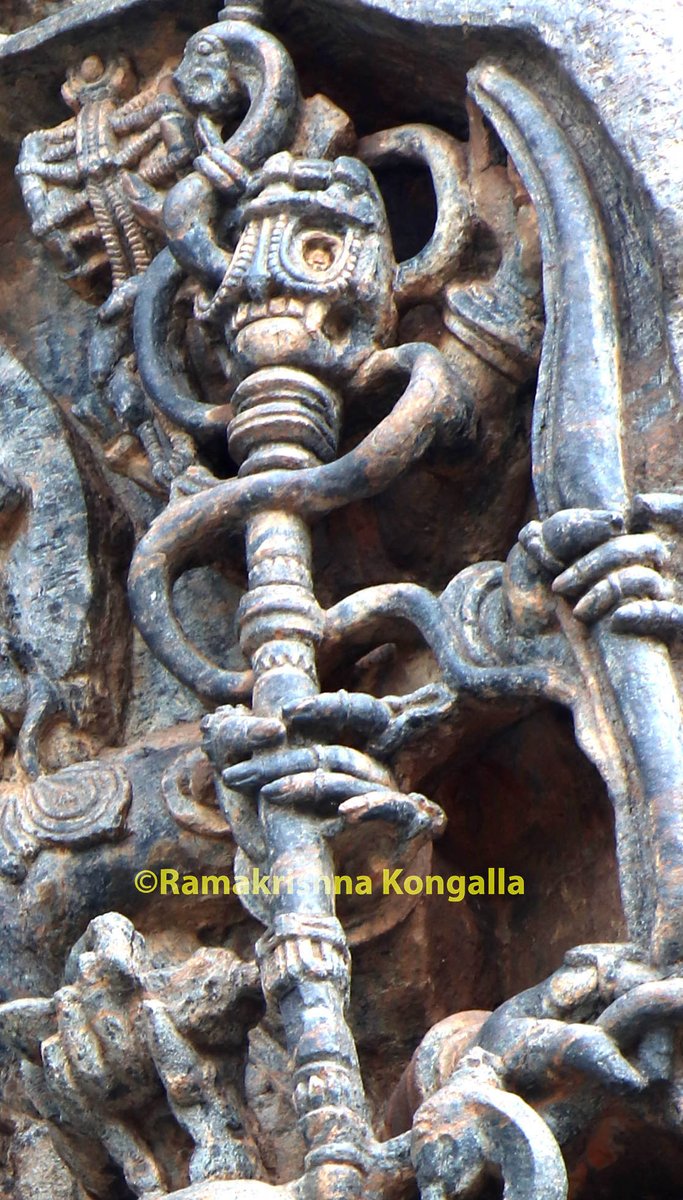 This is Khatvanga, the skull stick.but look at its intricacy, the snake going in and out of eye holes of skull is unimaginable.