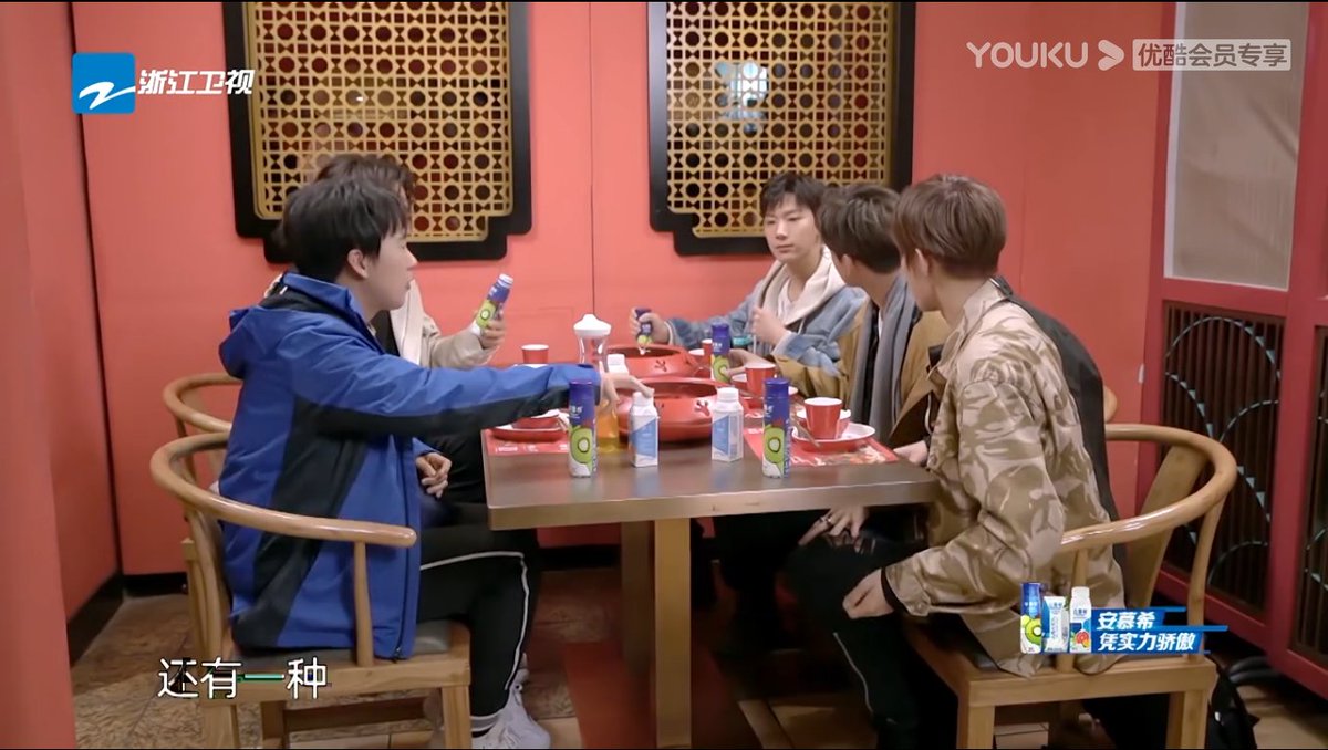 lucas being sensitive and a gentleman to exchange the seat for ten so ten can eat his hot pot more comfortablely.