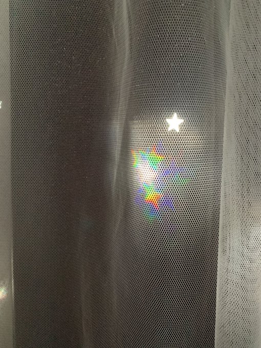 I put rainbow film on the window behind my star punch out curtains in my photo studio and you guuuuys