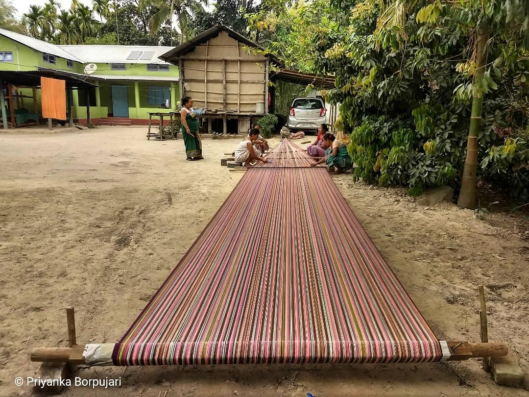 "বহো তাঁতৰ পাততচকু আলি বাটত""I sit and weave on the loomWith eyes on the street (for you)"Khalisanimari, Assam. @outofedenwalk with  @PaulSalopek has inasmuch been about eyes on the street (the next dhaba or moment of aha), as about weaving words to do justice to what we see.