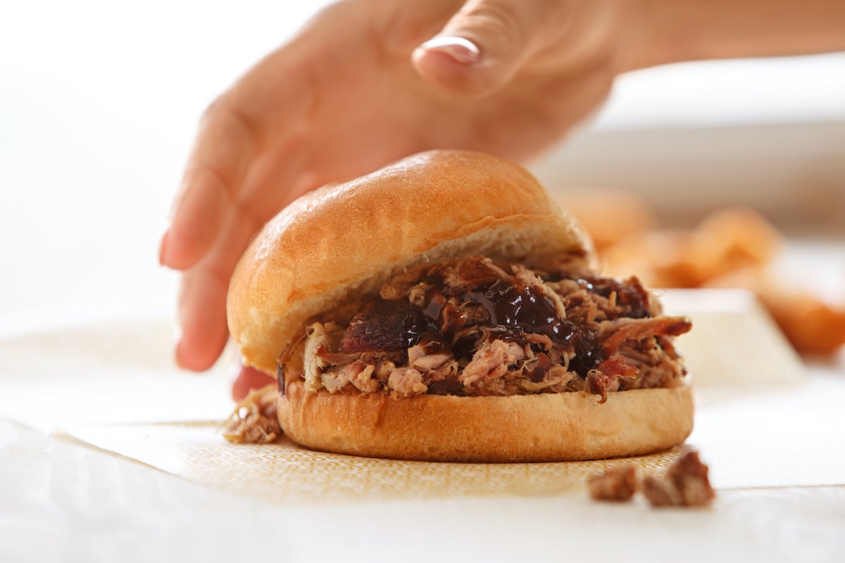 #BBQLovers unite! Get your hands on our Hickory Smoked BBQ and Salt &amp; Pepper Tater Tots! We cook our Carolina Pulled Pork low and slow on top of hickory coals, then we dress it with a kettle-cooked BBQ sauce that will have you licking your fingers after the sandwich is gone.