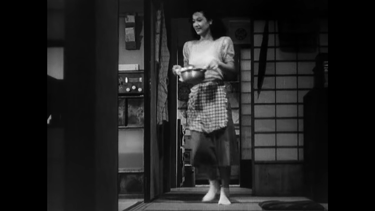 Back to the kitchen view as Noriko brings dinner to the table. The rhythm of this scene - so fraught with potential conflict for the film and Shukichi but with Noriko totally unaware - again demonstrates the effortless ballet of their domesticity.