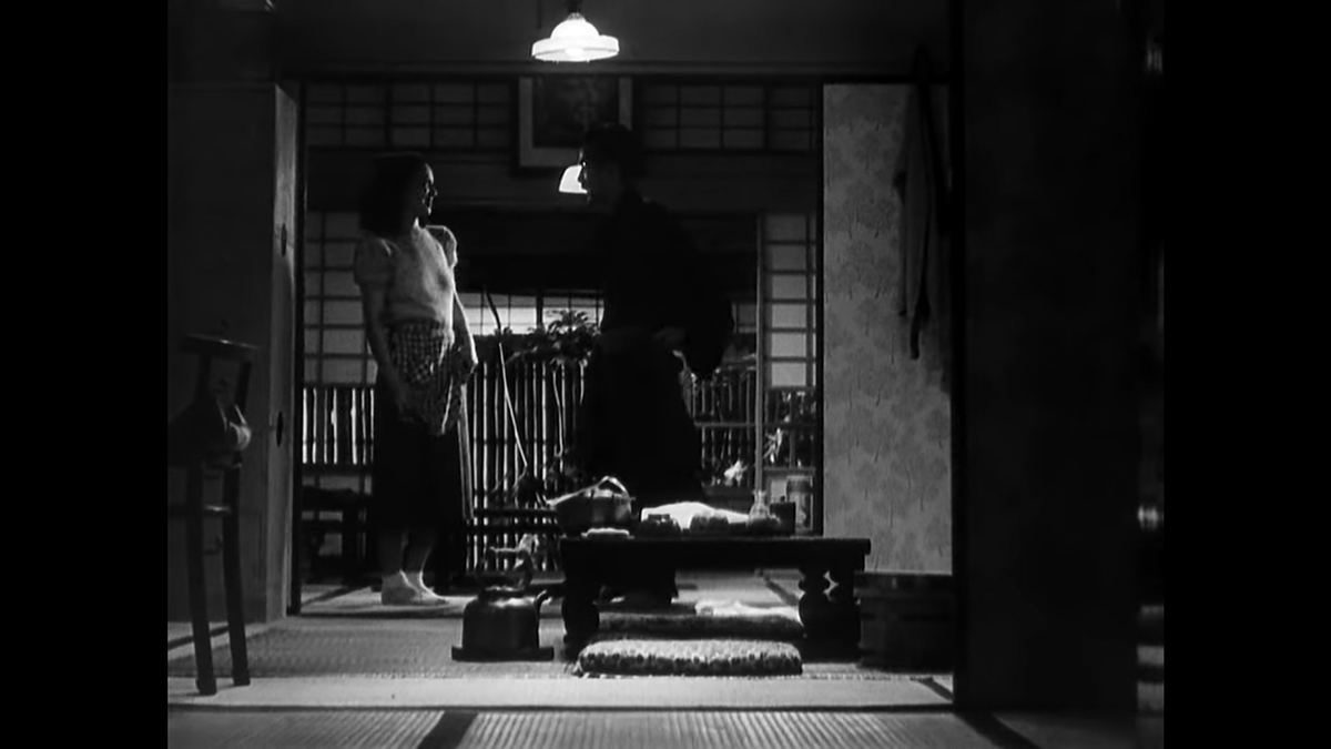 This lovely shot from a new angle seems to have been lit for the dinner table where they will sit. They are shrouded in darkness often and even when they do sit, Noriko has her back to us and obscures Shukichi. Ozu even holds as they begin to eat in silence.