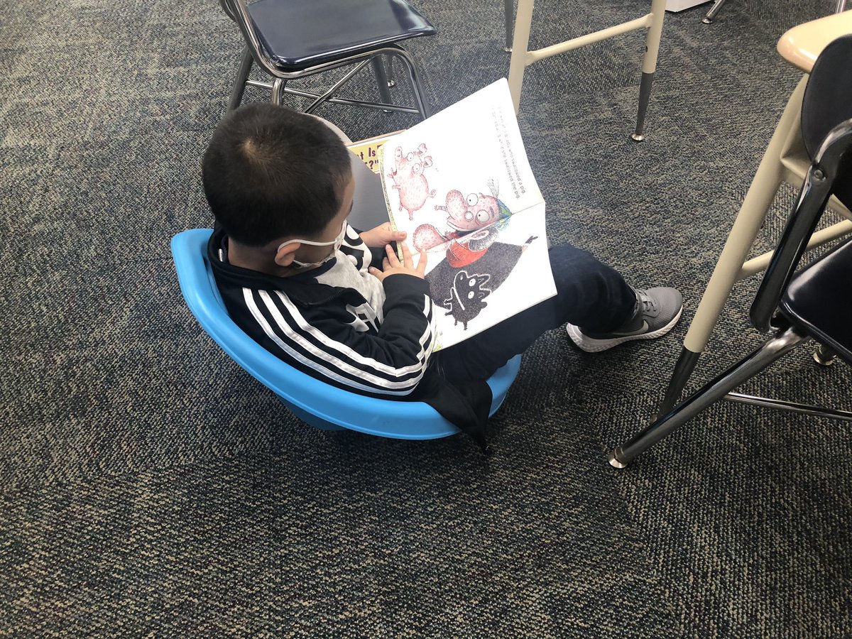 First grade readers trying out scoop rockers and enjoying some books.