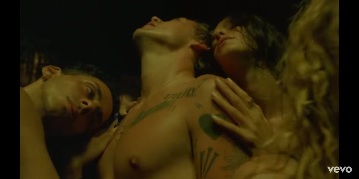 Scenes depicting him surrounded by people, semi nude, touching him and each other, are a loud message of his sexuality. He never does make eye contact with these people, alluding to only a physical connection, which goes with the theme of the album: "having sex and feeling sad."