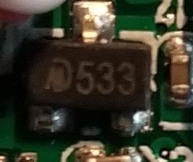 I'm not 100% sure because it has so little markings, but I think this is an HM533 voltage regulator.It takes in the voltage from the battery or USB power and turns it into 3.3v, for the microcontroller.