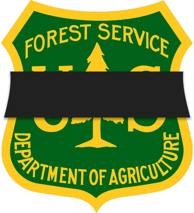 The Forest Service shield with a black shroud across the middle of it horizontally. 