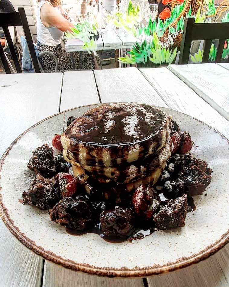 Sweet tooth pancake stack. Fluffy pancakes // chocolate sauce // marshmallows // brownie bits // strawberries // blueberries. 🥞 🍓 🍫 ENJOY! #chorlton #manchester #manchesterfood #manchesterlife #sweettooth