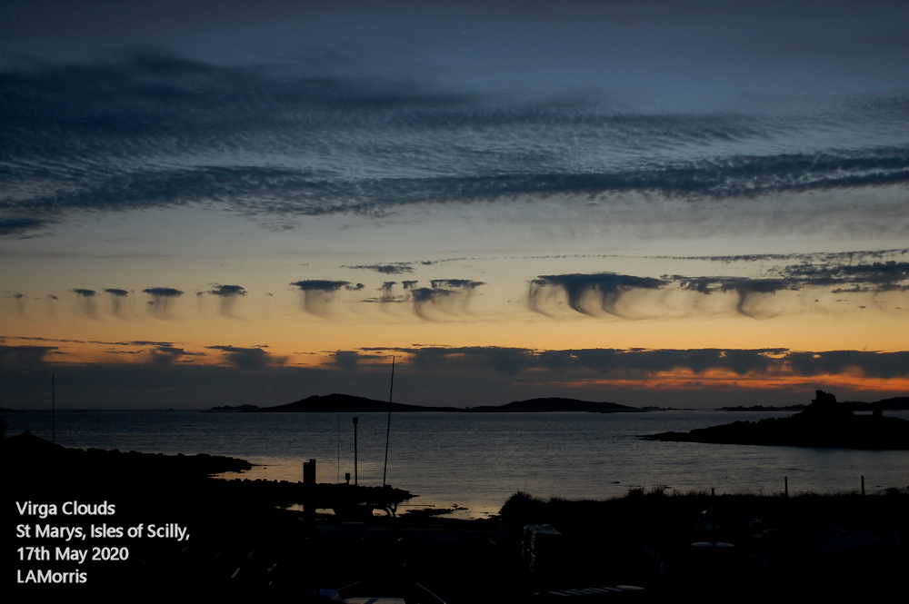 GlandoreScilly's tweet photo. Taken just a few yards from our house and Gallery, a peaceful evening seascape with stunningly beautiful ethereal 'virga' clouds. We have lived here for over 40 years and never tire of their ever changing magical beauty💛 #downbythewater #Scilly #MyNationalLandscapes @AONBFamily https://t.co/1bTs0lfOnZ