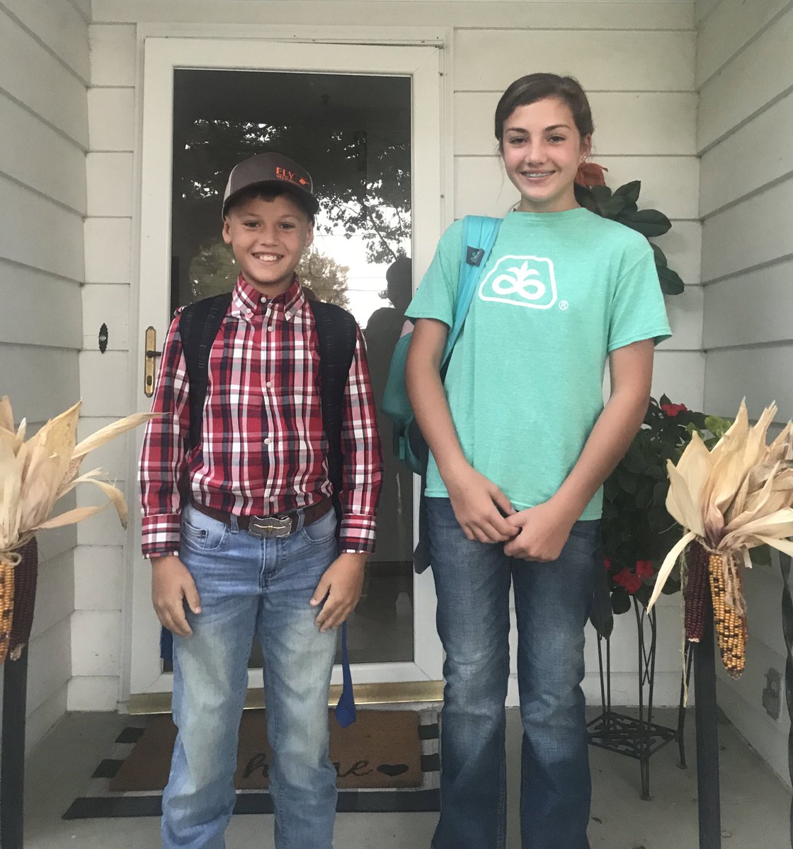 LoessHillsAg's tweet photo. Farmer day at school today for homecoming week. Proud of these two for supporting our industry. Kellan wanted to bring a heifer to school as well, wouldn’t fit on the bus. #harvest2020 @PioneerSeeds @tctrojans https://t.co/HNfXnU6TPL