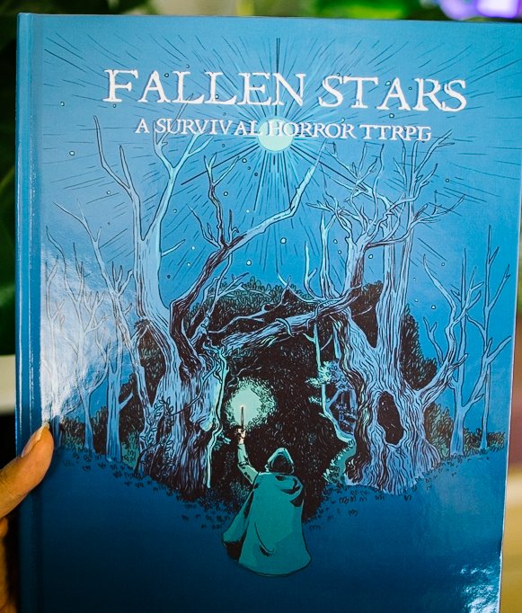leithbrownlee's tweet photo. Fallen Stars hardbacks are being unleashed upon the world and I couldn't be more excited seeing everyone's photos.

If you like dark fantasy, survival horror, or just want to support new ttrpgs, check it out here: https://t.co/hOAInpWzE8 @DriveThruRPG #dnd #ttrpg https://t.co/08rLYSPm9A