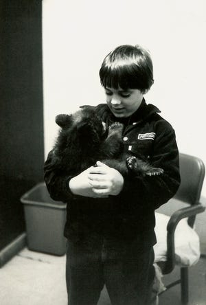 It all begin, one day.As a boy.Holding a bear cub.