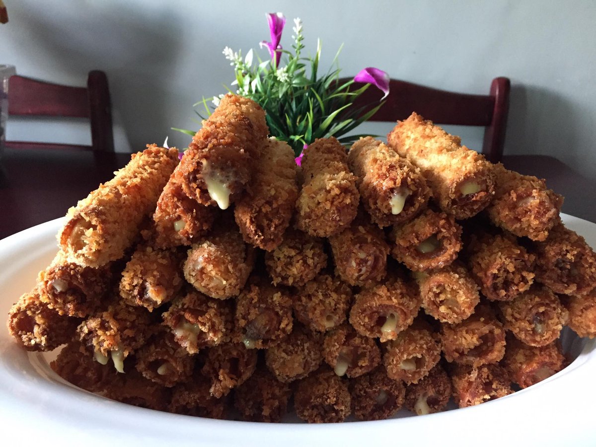 Bread roll with hotdogs and cheese.  Made by my wife