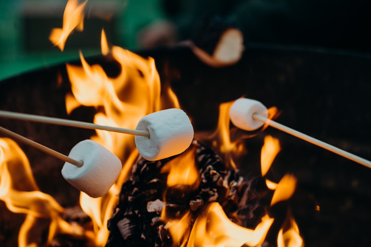  Making s'mores Okay, now we're craving one. Or several. Sitting by a fire, eating yummy treats in cool weather? Sounds like a great night to us!