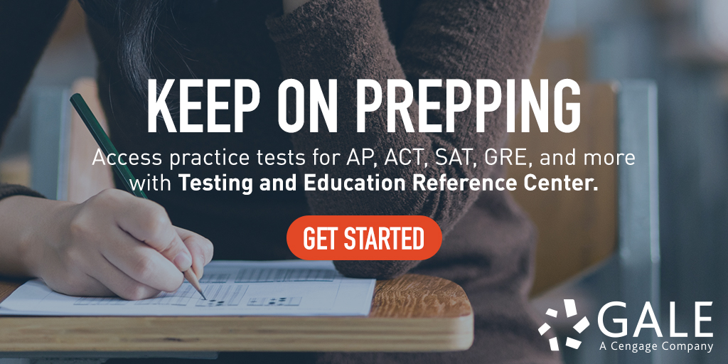 a woman sitting at a desk writing on a piece of paper.