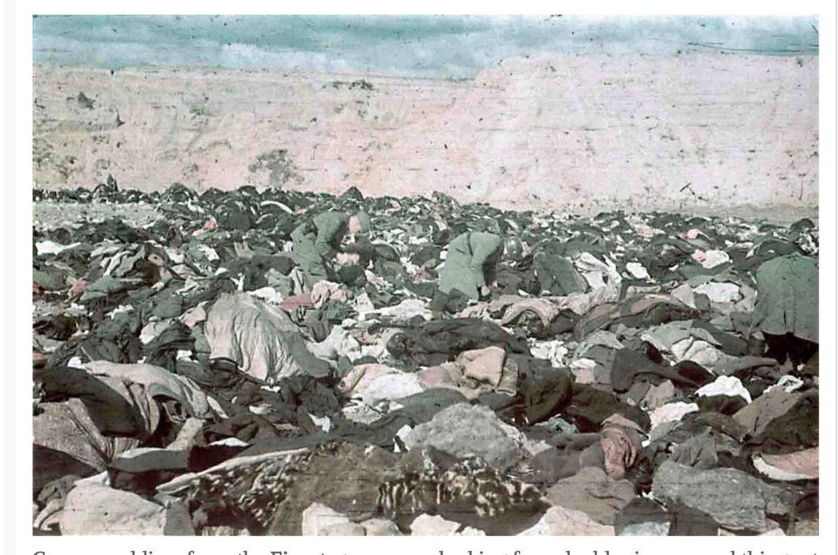 German Soldiers sorting out the valuables amongst the dead...