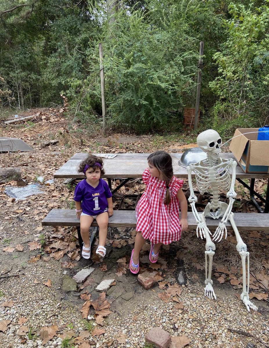 jamiecockerham's tweet photo. My niece was not amused about sitting by this skeleton for a pic😂💀 https://t.co/QUermf9QEM