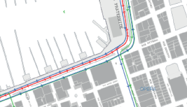 6/n. Projet 1 : maintien des circulations motorisées sur tout le parcours. Exemple 1 : sur le Quai Rive Neuve, piste cyclable réservée et protégée au milieu de la chaussée (ligne rouge).