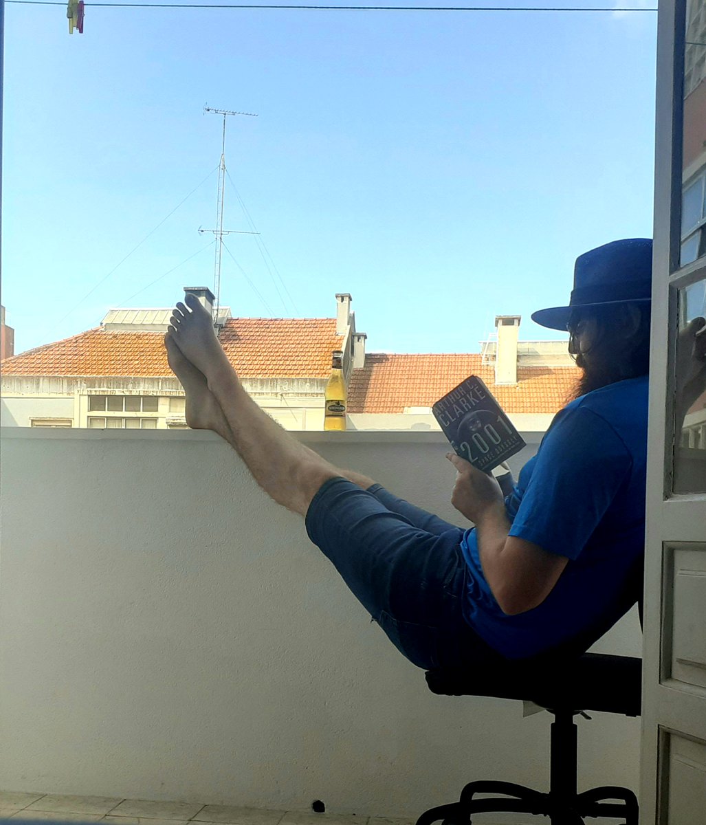 1. Matthew Cox reading "2001: A Space Odyssey" by Arthur C Clarke in sunny Lisbon, Portugal.