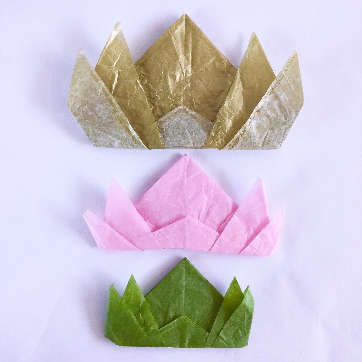 blahtoTADA's tweet photo. I recycled wrapping paper by making origami lotus flowers...TADA! These are for #thelotuseffect, a community art installation by the @RubinMuseum. Lotus flowers bloom in muddy waters, a reminder that beauty can emerge from the toughest conditions. #origami #lotus #rubinmuseum https://t.co/N8U94G57UL