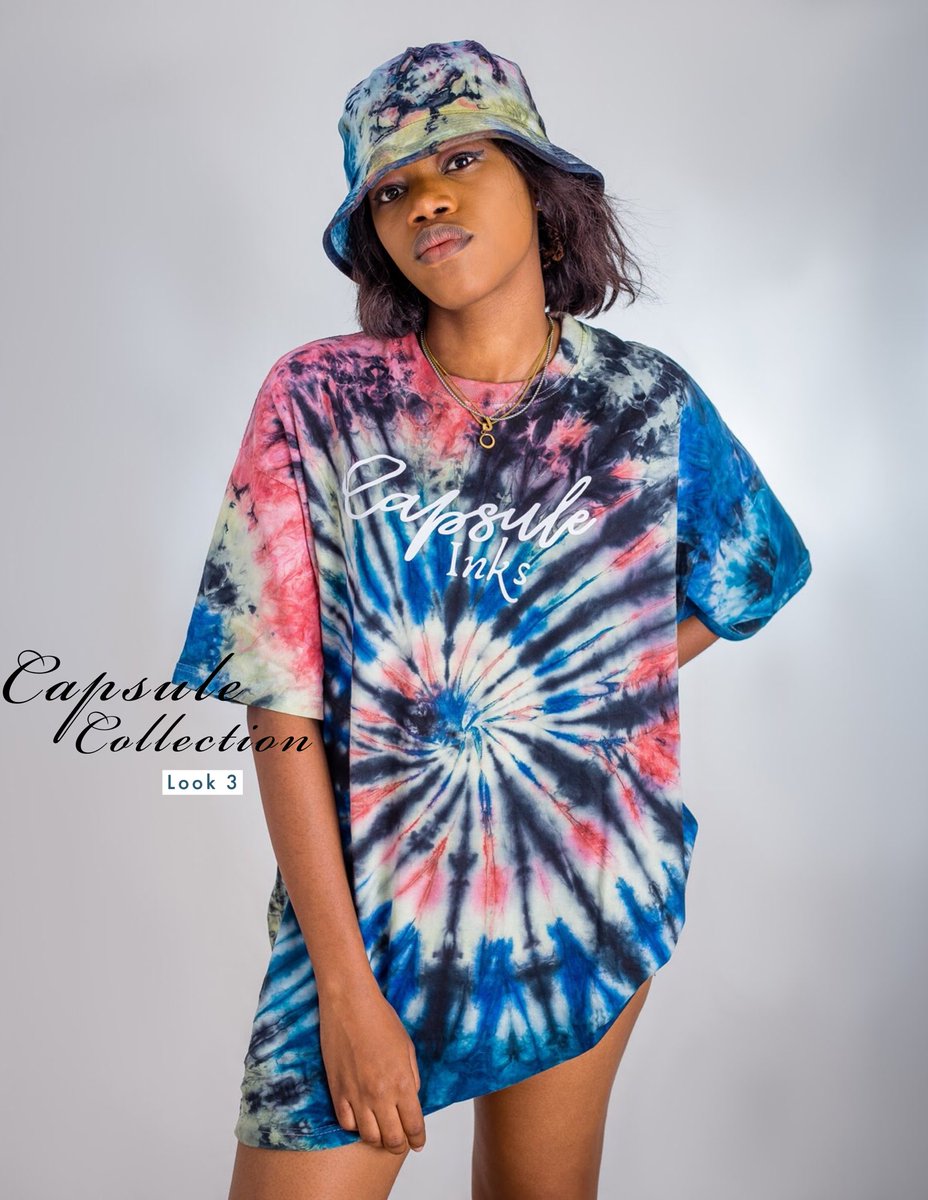 We’ve got our model in a very colorful oversized Tee, bucket hat and socks with the perfect blend of yello,pink and different hues of blue and a splash of black!! A beautiful print of our 20/21 collection we know you love!! #adire  #adireshirt