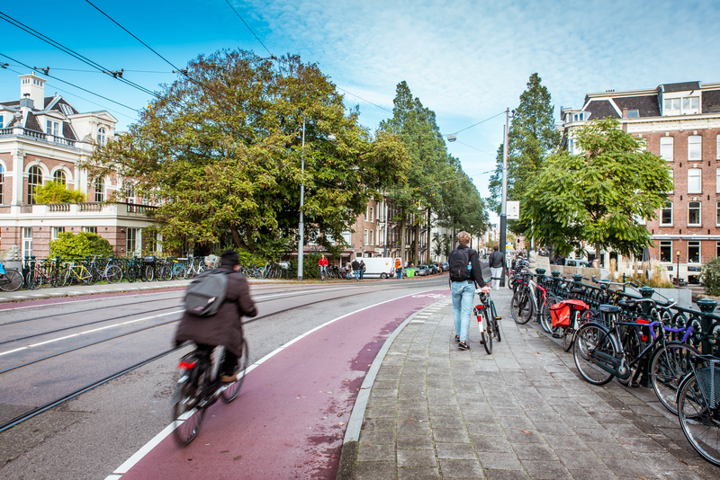 Iamsterdam's tweet photo. What makes Amsterdam – and the Netherlands – such a great place to explore on two wheels? Invisible bicycle infrastructure! Check out this video from @notjustbikes for more information: https://t.co/LuOXN7qm6s https://t.co/EzxSwUNylt