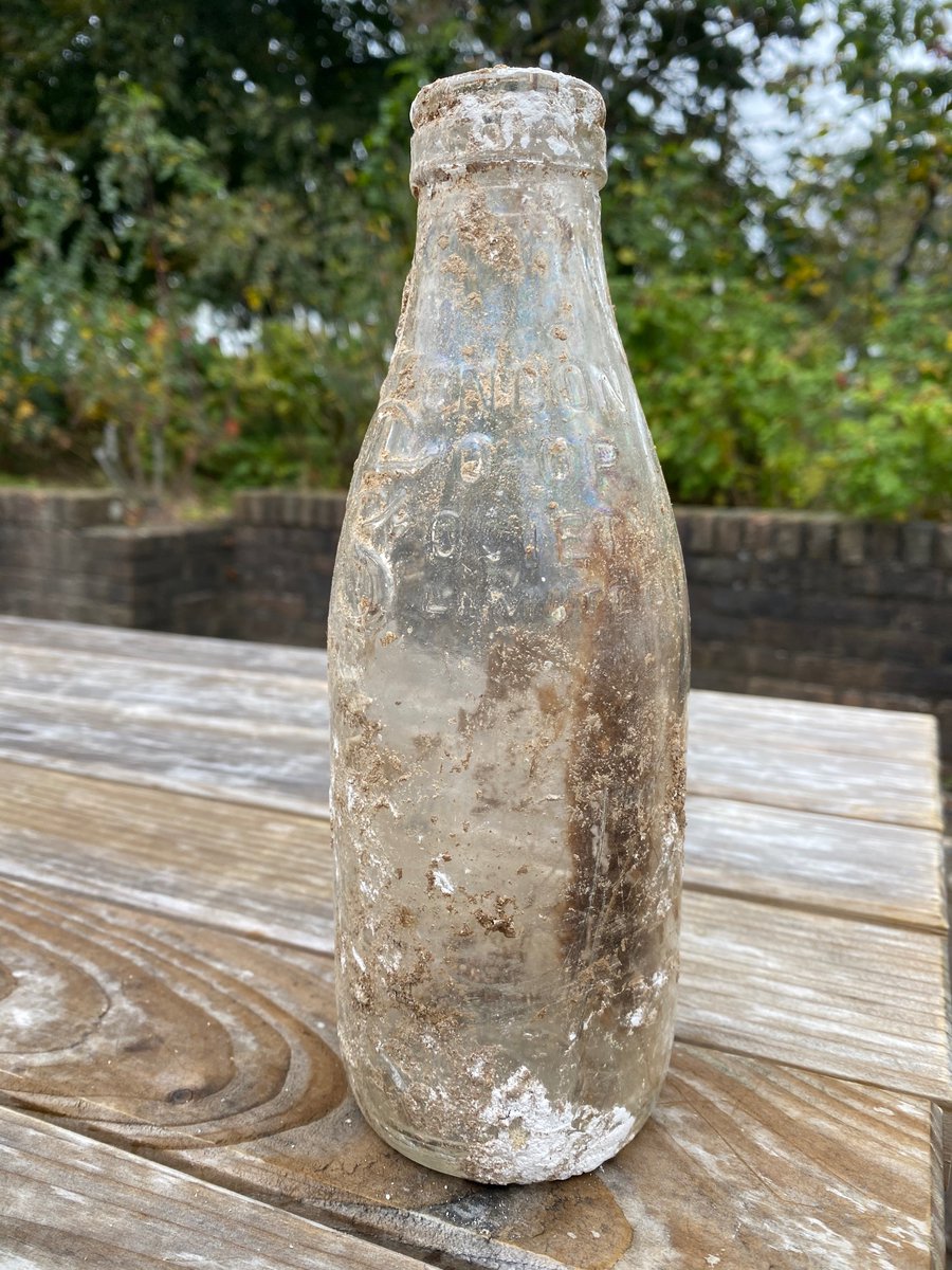 JHGSHW's tweet image. Amazing find by the team working on the new build today: an intact vintage glass milk bottle from the London Co Op Society (research shows this must predate 1981!!). Wondering what other wonders might be lurking!! #BeMoreKnowledgeable